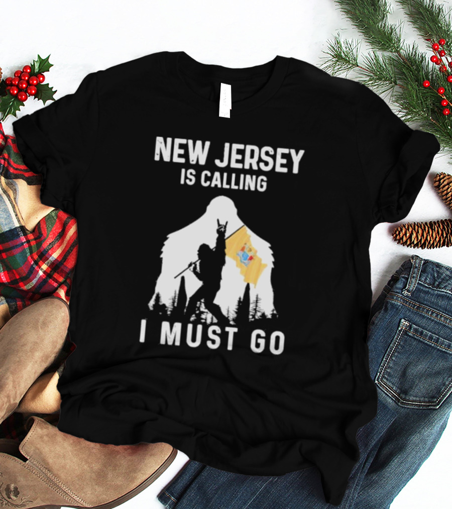 New Jersey Is Calling I Must Go Bigfoot Holding New Jersey Flag T-Shirt