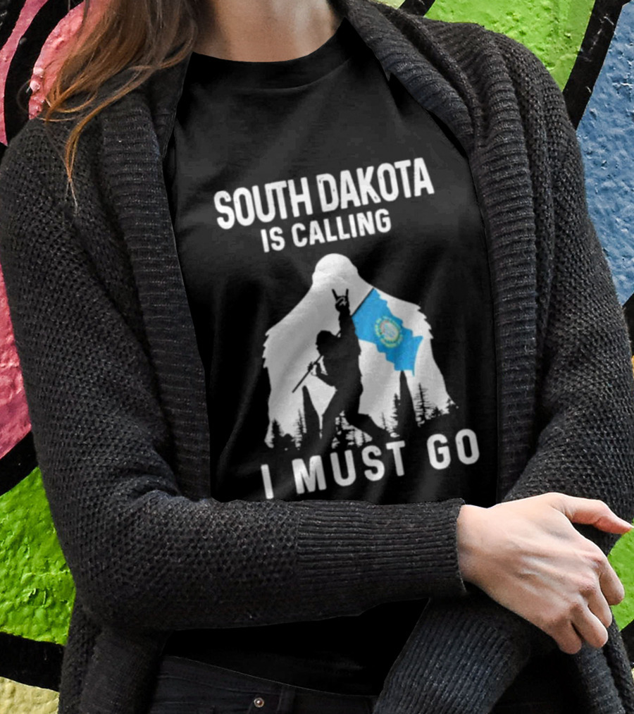 South Dakota Is Calling I Must Go Bigfoot Holding South Dakota Flag T-Shirt