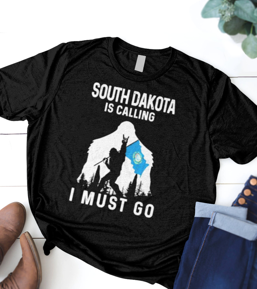South Dakota Is Calling I Must Go Bigfoot Holding South Dakota Flag T-Shirt