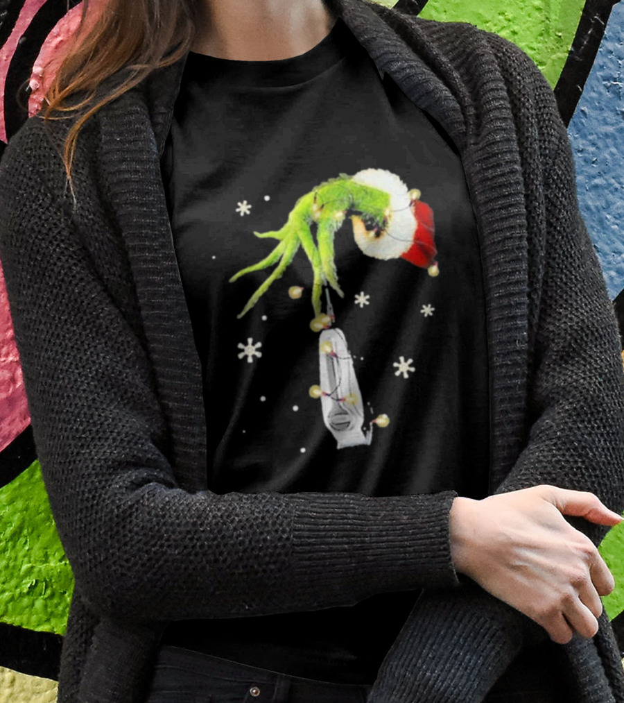 Grinch Christmas Hand Holding Clipper Snowflakes Santa Hat T-Shirt