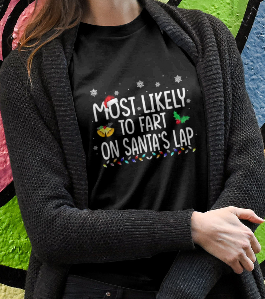 Most Likely To Fart On Santa’s Lap Christmas Holiday Family Humor Santa Hat Snowflakes Lights T-Shirt