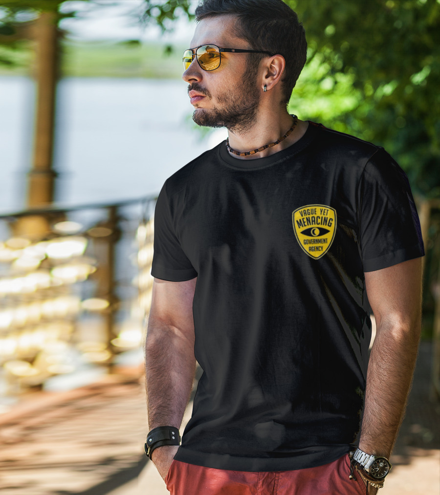 Vague Yet Menacing Government Agency Yellow Badge With Eye T-Shirt