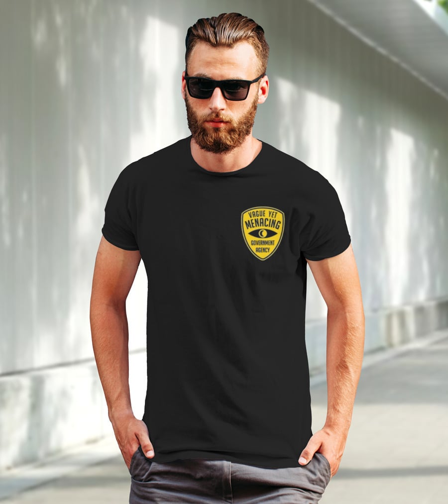 Vague Yet Menacing Government Agency Yellow Badge With Eye T-Shirt