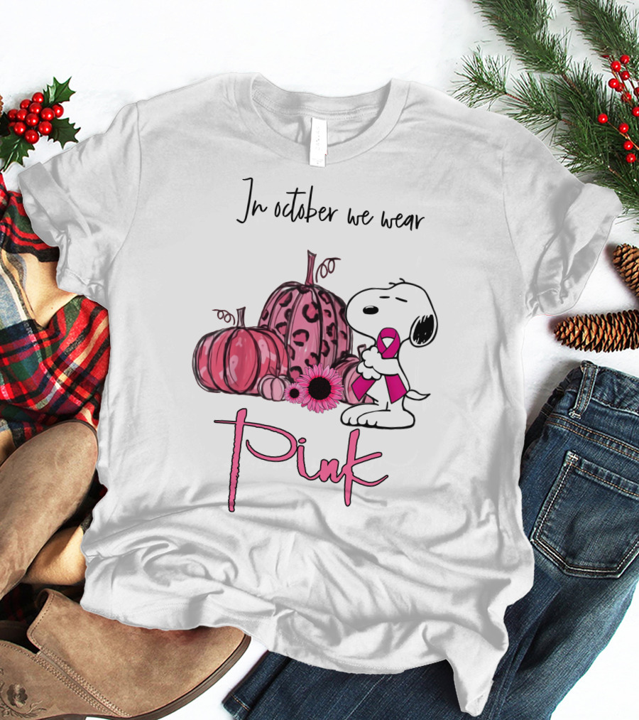 In October We Wear Pink With Peanuts Character Holding Ribbon And Pumpkins T-Shirt