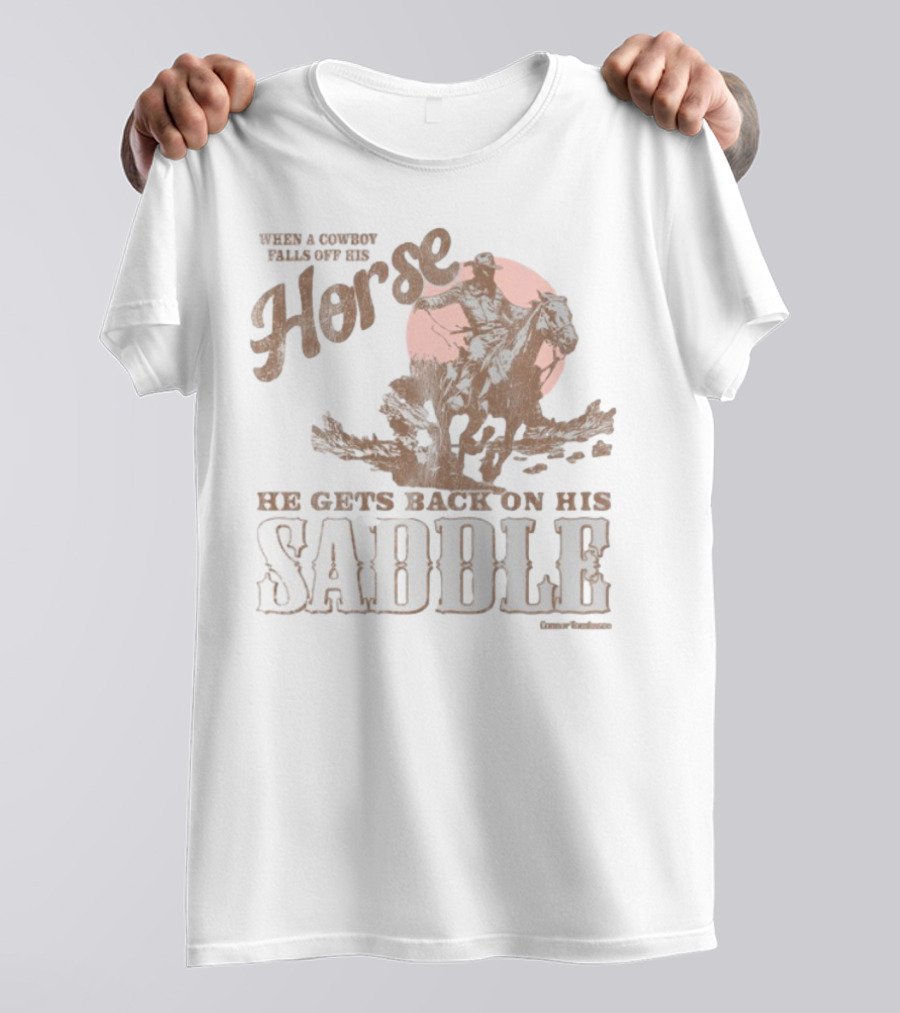 When A Cowboy Falls Off His Horse He Gets Back On His Saddle T-Shirt