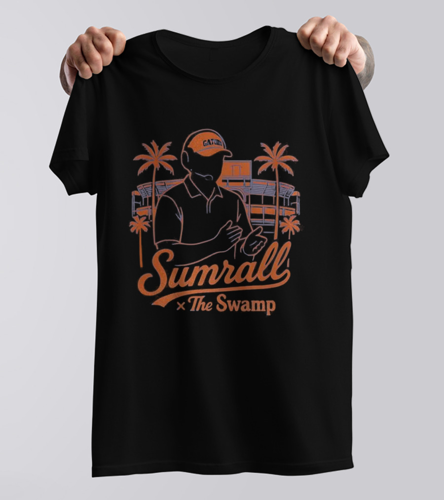 Sumrall The Swamp Coach Illustration With Palm Trees And Building Background T-Shirt