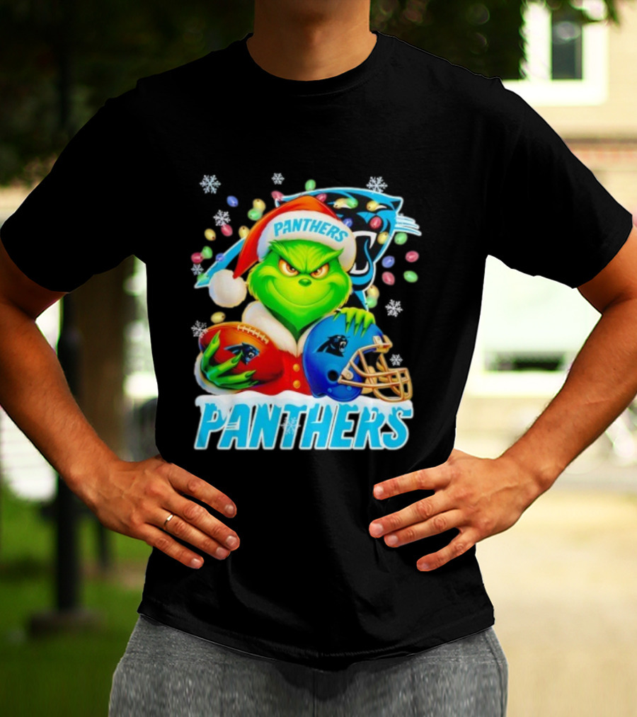Grinch Santa Hat Holding Carolina Panthers Football And Helmet Merry Christmas T-Shirt