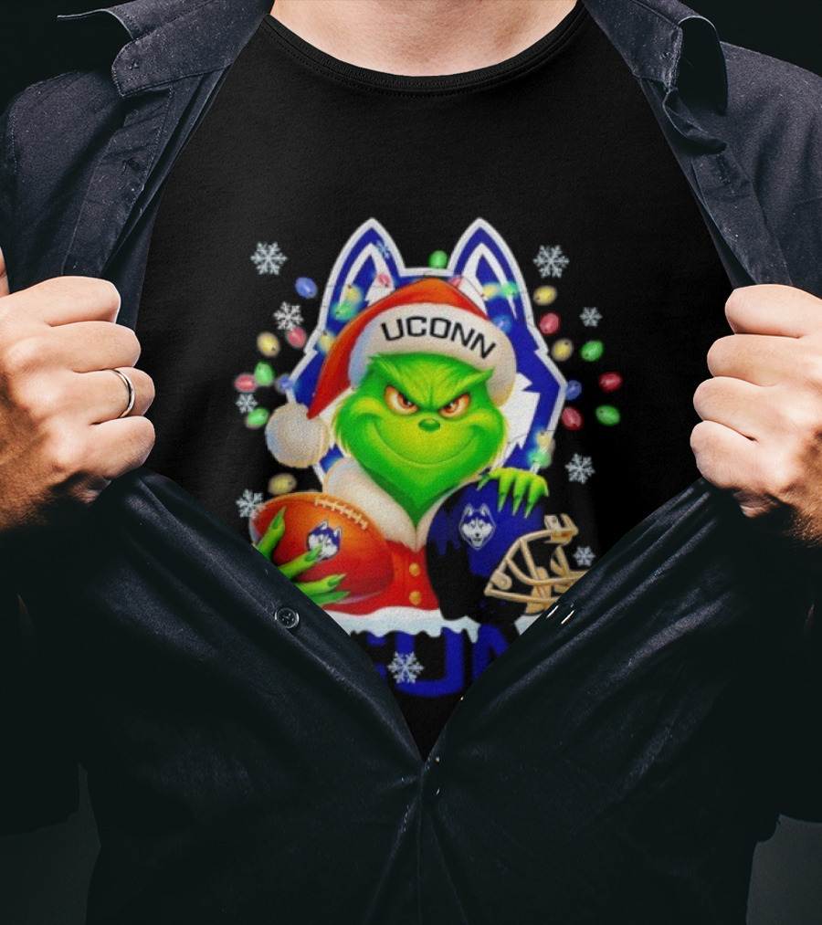 Grinch Wearing Santa Hat With UConn Huskies Football And Helmet Merry Christmas T-Shirt