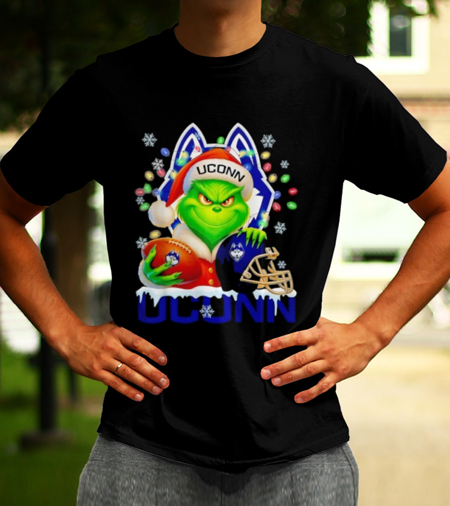 Grinch Wearing Santa Hat With UConn Huskies Football And Helmet Merry Christmas T-Shirt