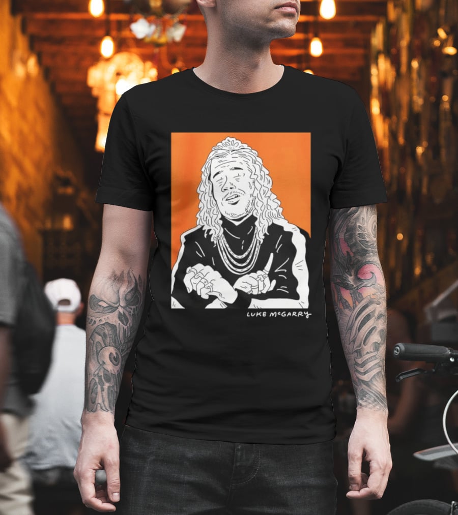 Luke McGarry Cartoon Character With Long Hair And Chains On Orange T-Shirt