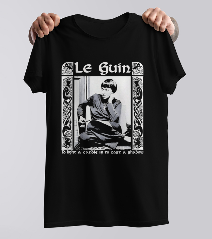 Le Guin To Light A Candle Is To Cast A Shadow T-Shirt