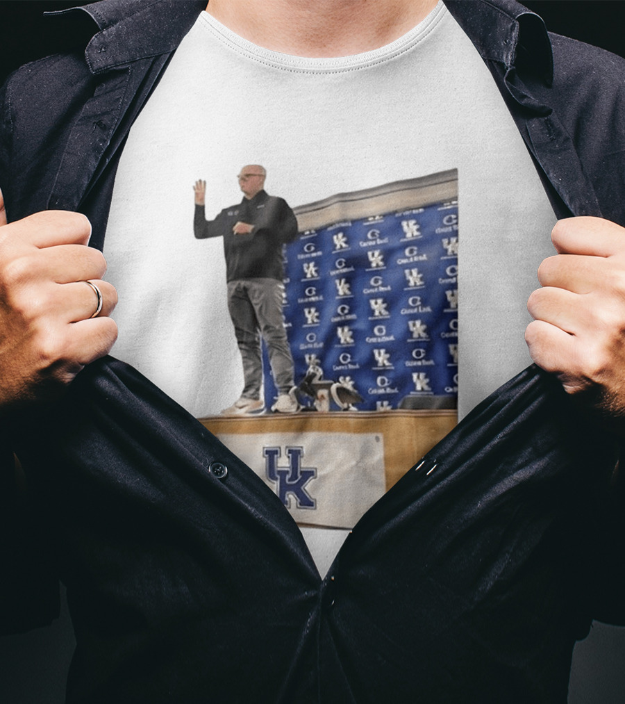 UK Volleyball Coach Craig Skinner Standing On Table With UK Logo And Awards T-Shirt