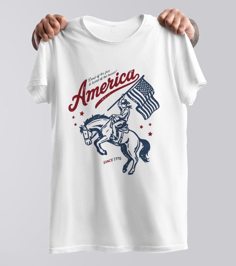 America Land Of The Free Home Of The Brave Since 1776 Cowboy Holding Flag Patriotic T-Shirt