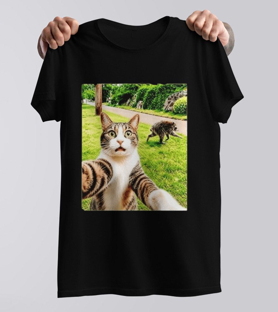 Shocked Face Tabby Cat Taking Selfie With Running Raccoon On Lawn Road T-Shirt