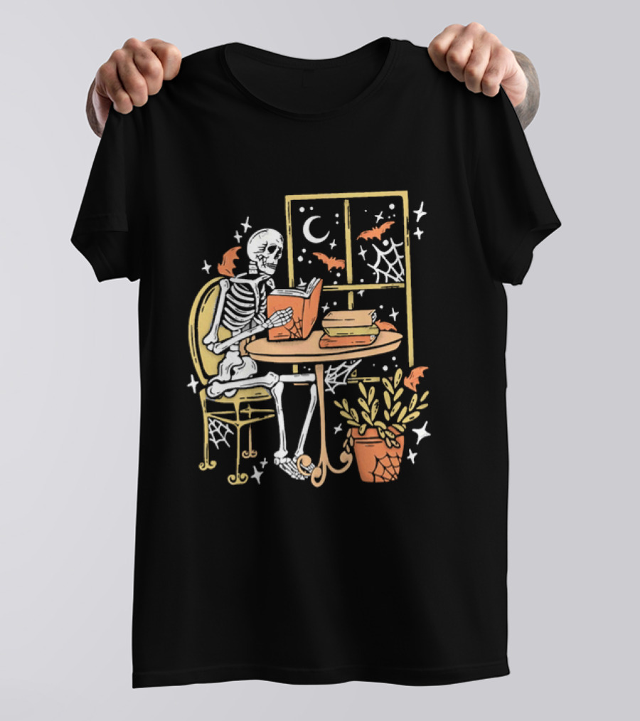 Cartoon Skeleton Reading Under Crescent Moon With Bats Orange Book Table Window T-Shirt