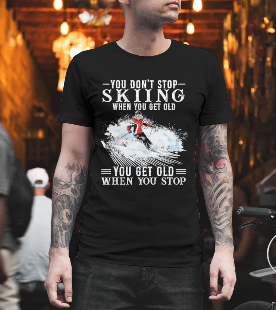 You Don't Stop Skiing When You Get Old You Get Old When You Stop Older Woman Skier Spraying Snow T-Shirt