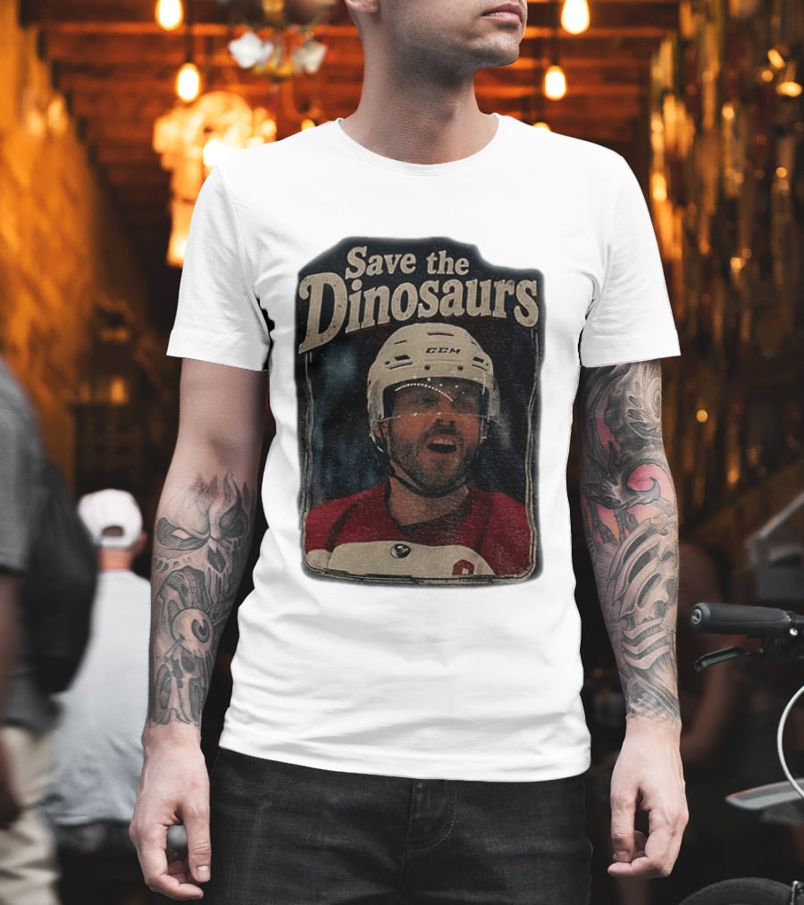 Connor Storrie Wearing Scott Hunter Save The Dinosaurs CCM Hockey T-Shirt