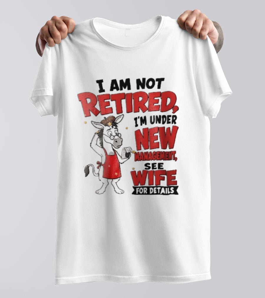 I Am Not Retired I'm Under New Management See Wife For Details Cartoon Donkey Red Apron T-Shirt
