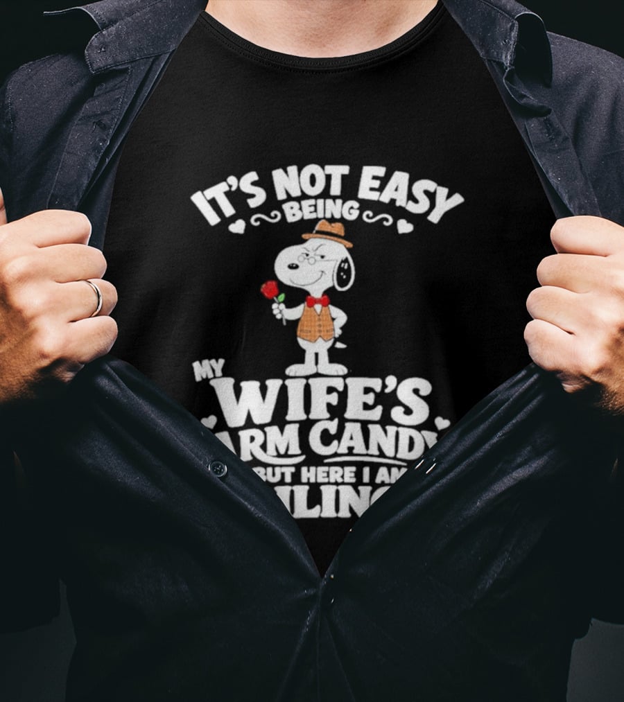 Snoopy It's Not Easy Being My Wife's Arm Candy But Here I Am Nailing It T-Shirt