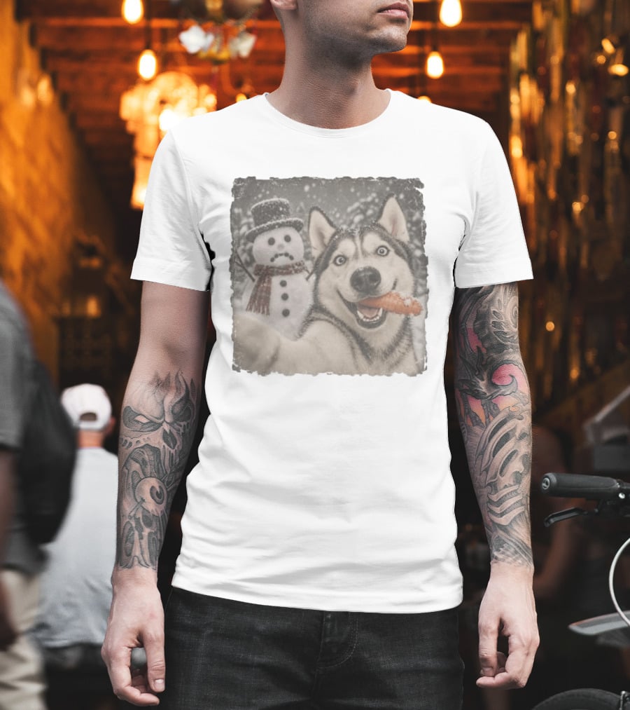 A Sled Dog With A Carrot And A Sad Snowman In A Snowy Winter Scene T-Shirt