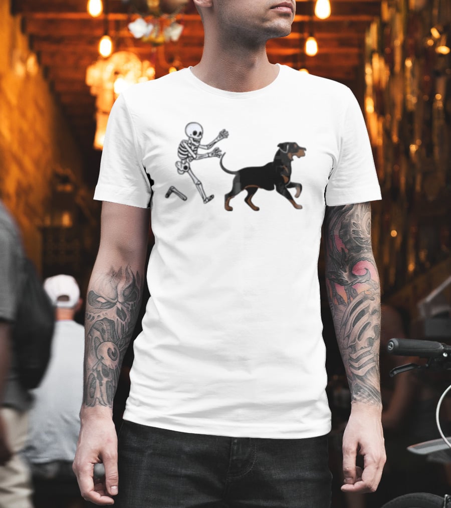 Skeleton Chasing Rottweiler With Bone In Halloween Humor Scene T-Shirt