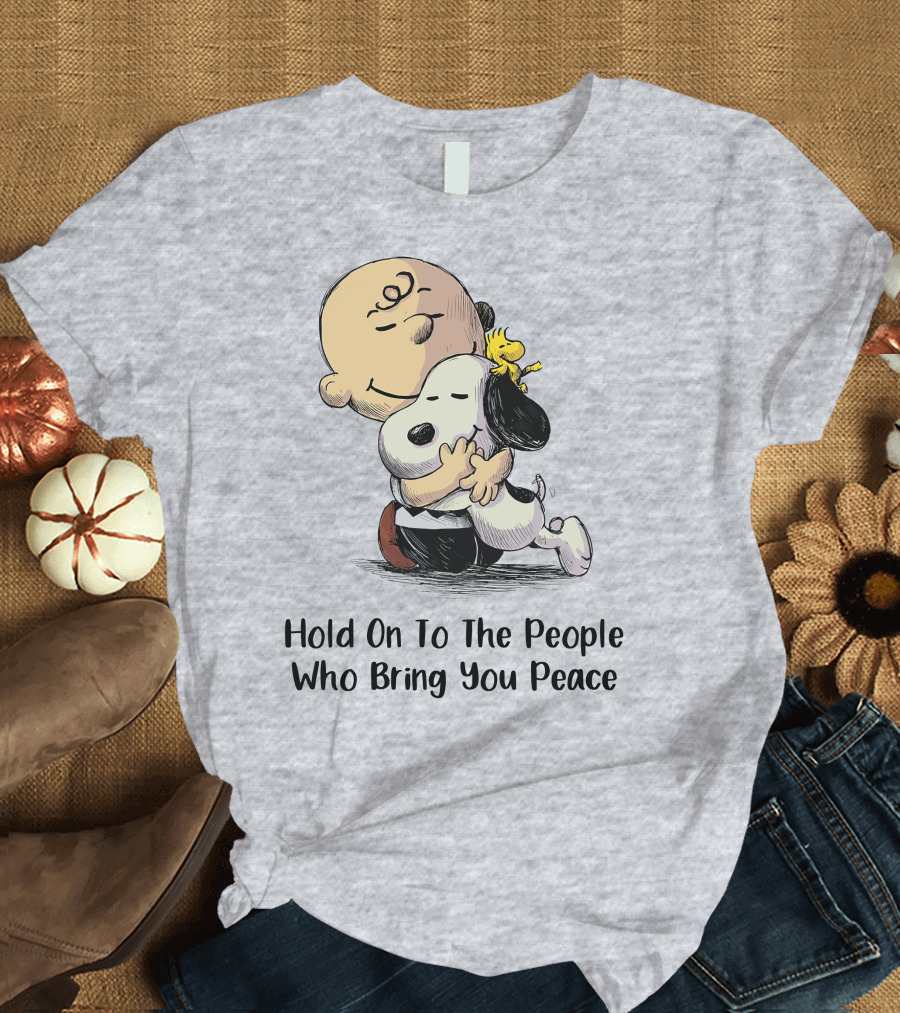 Hold On To The People Who Bring You Peace Charlie Brown Snoopy Woodstock Hug T-Shirt