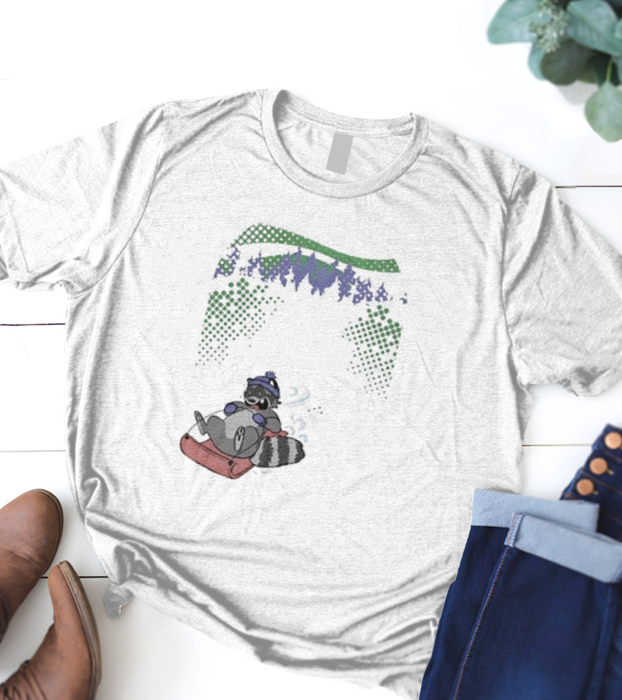 Raccoon Sledding In Winter Forest Scene With Evergreen Trees And Snowflakes T-Shirt