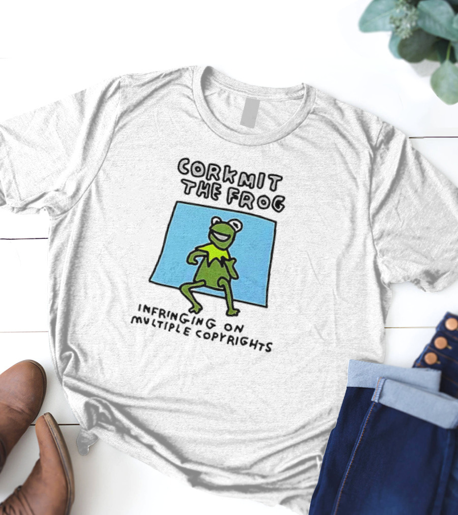 Corkmit The Frog Infringing On Multiple Copyrights Green Frog Cartoon With Blue Background T-Shirt