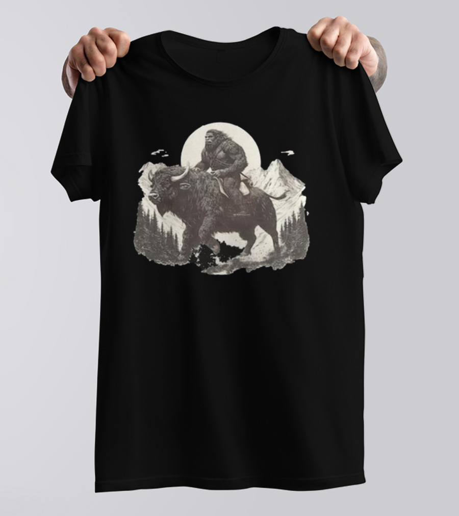 Blurry Creatures Bigfoot Riding Buffalo With Mountains And Moon In Background T-Shirt