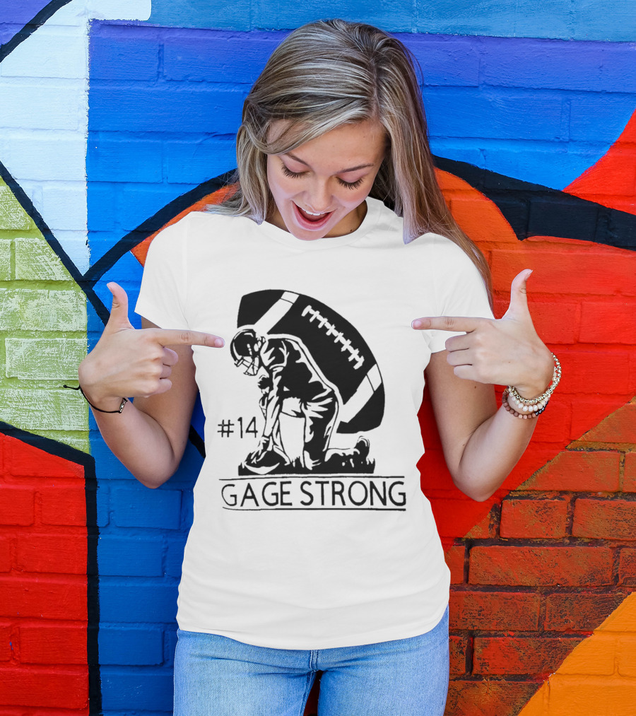 Gage Strong #14 Football Player Kneeling In Front Of Large Football T-Shirt