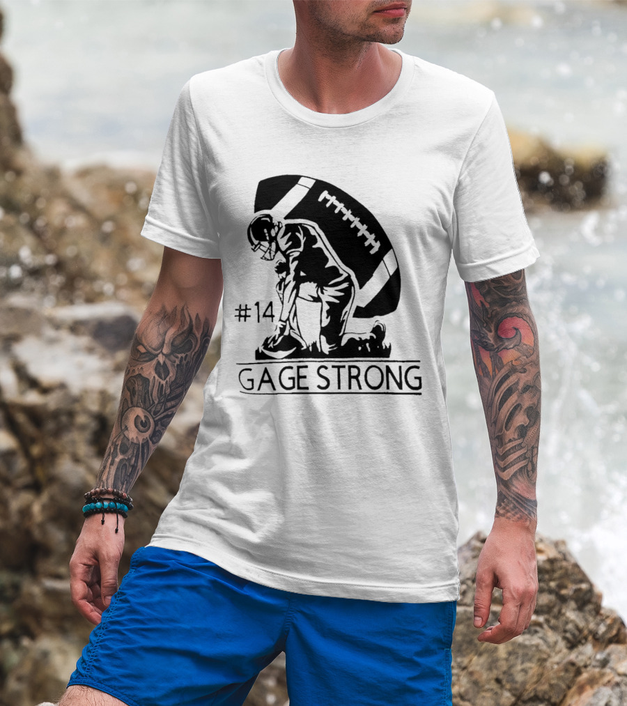 Gage Strong #14 Football Player Kneeling In Front Of Large Football T-Shirt