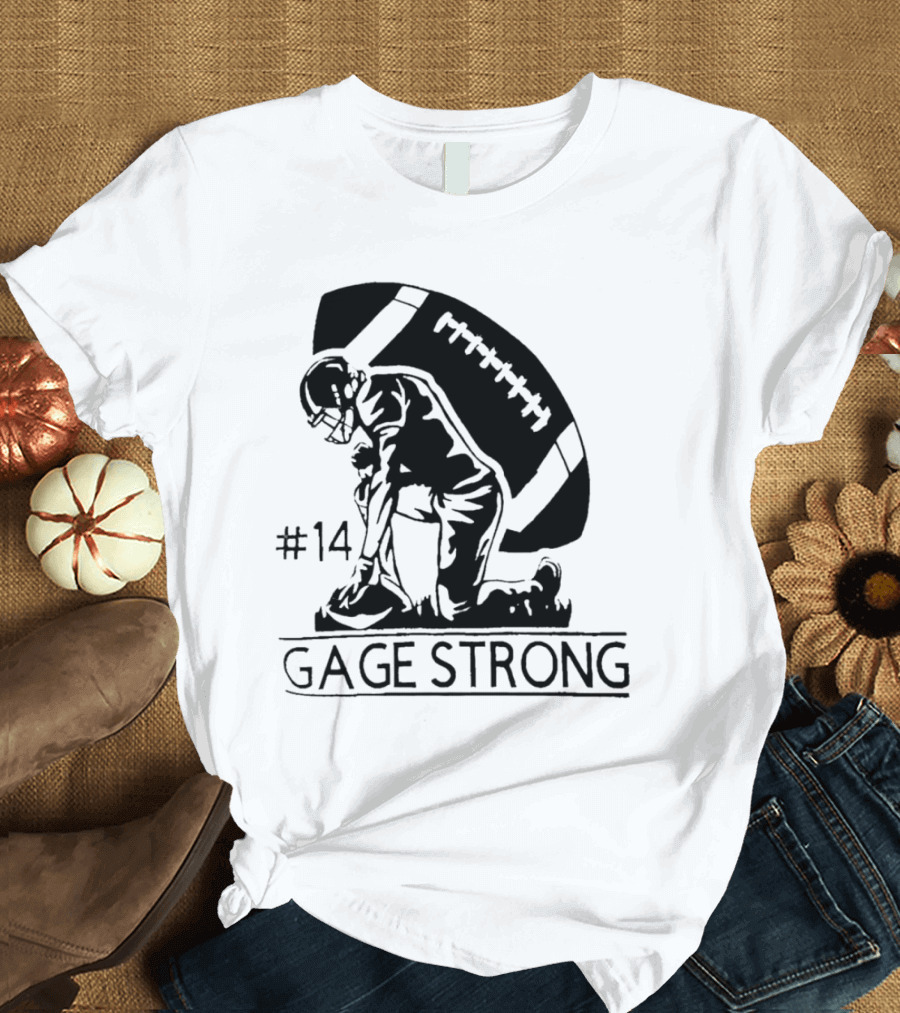 Gage Strong #14 Football Player Kneeling In Front Of Large Football T-Shirt