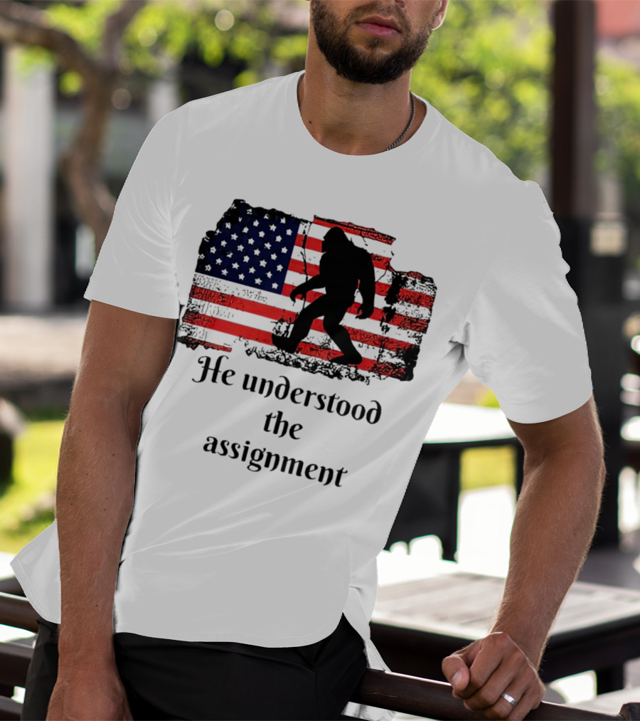 Bigfoot Silhouette With Distressed American Flag He Understood The Assignment T-Shirt