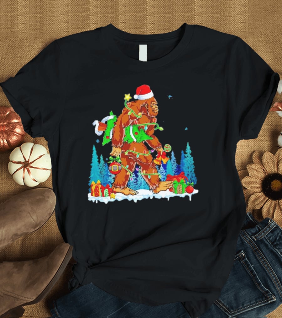 Bigfoot Santa Hugging Christmas Tree With Gifts And Snow Scene T-Shirt