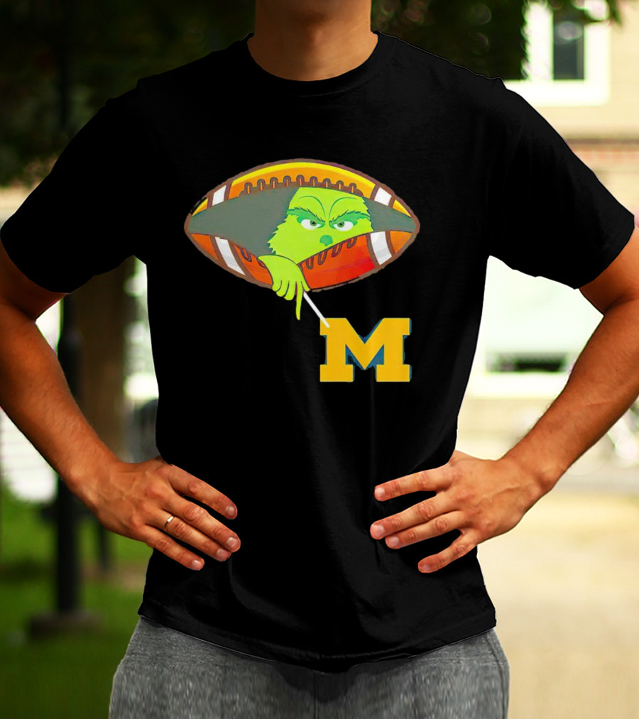 Grinch Peeking From Football Over Michigan Wolverines T-Shirt