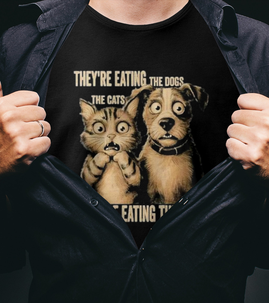 THEY'RE EATING THE DOGS THE CATS THEY'RE EATING THE PETS T-Shirt
